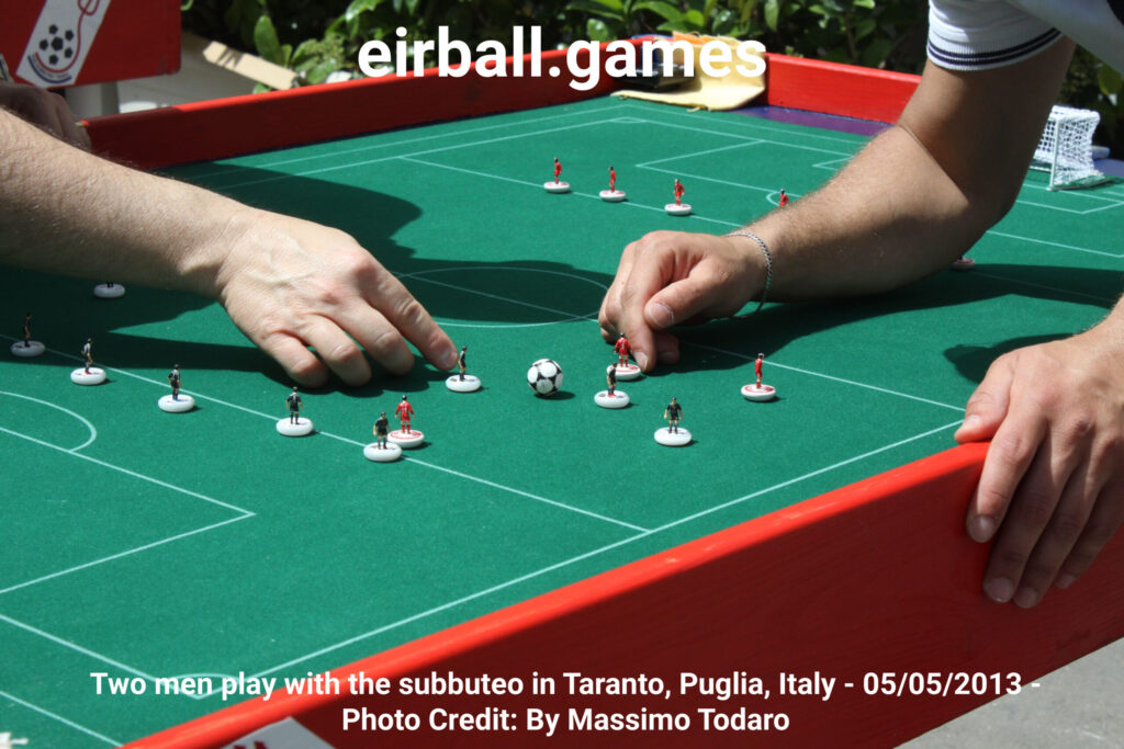Two men play with the subbuteo in Taranto, Puglia, Italy - 05/05/2013
